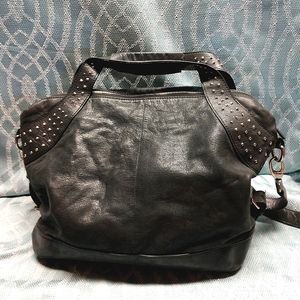 BCBG Maxazria leather handbag black distressed look. Gently used.